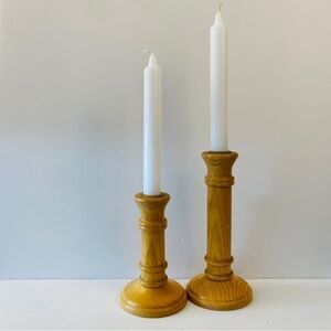 Wooden candlesticks, set of two different heights, brass accents, light colour